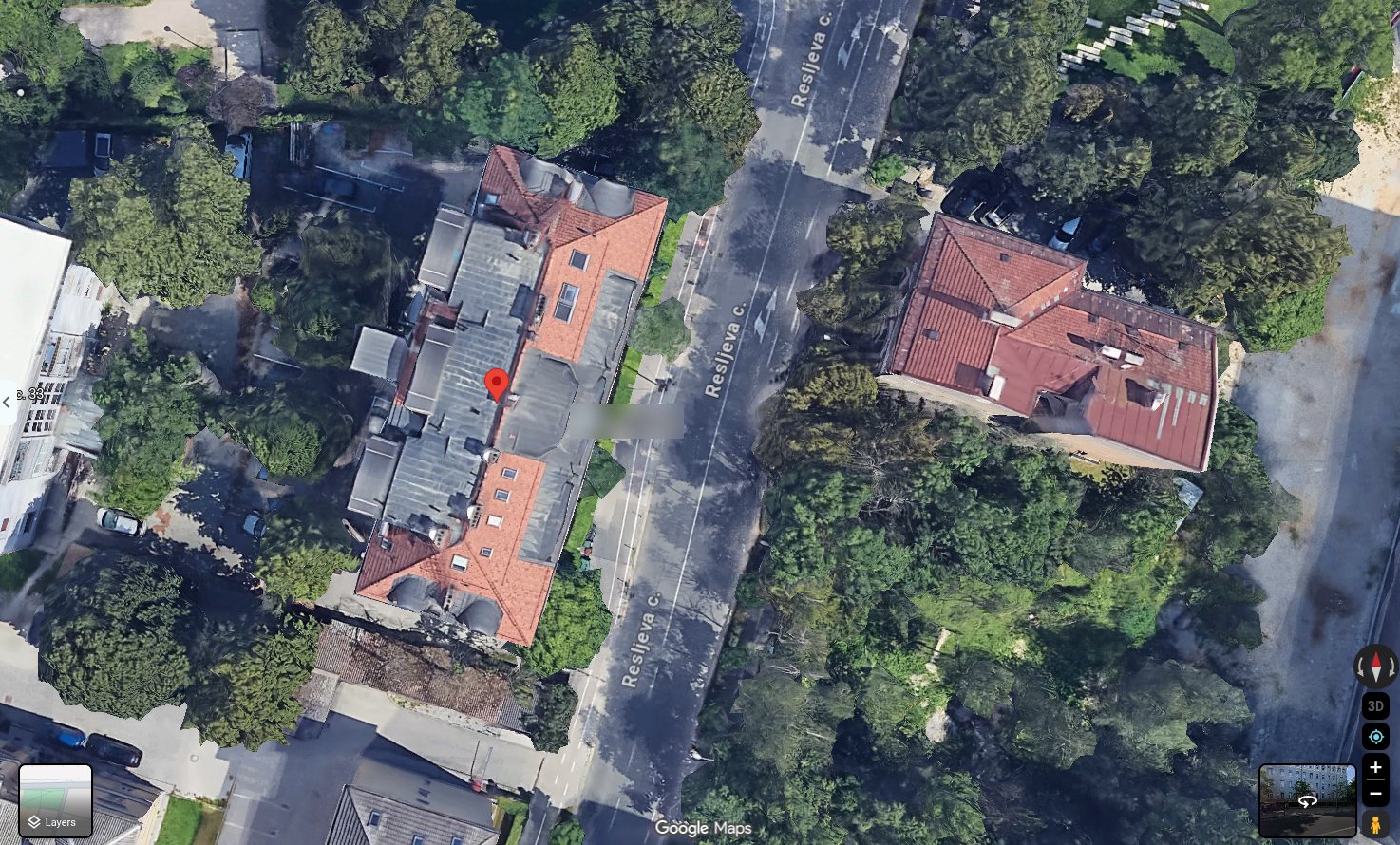Satellite view of the building at Resljeva cesta 35, Ljubljana, with a red marker on its roof.